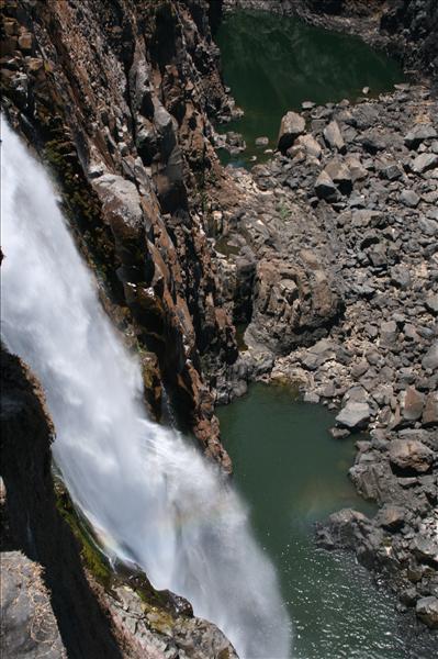 Zimbabwe. Victoria Falls. Steam train. Man looking out of window